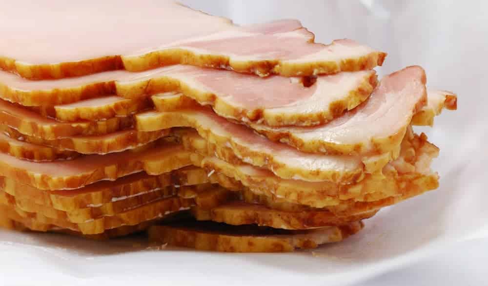 A close look at a stack of Canadian bacon.