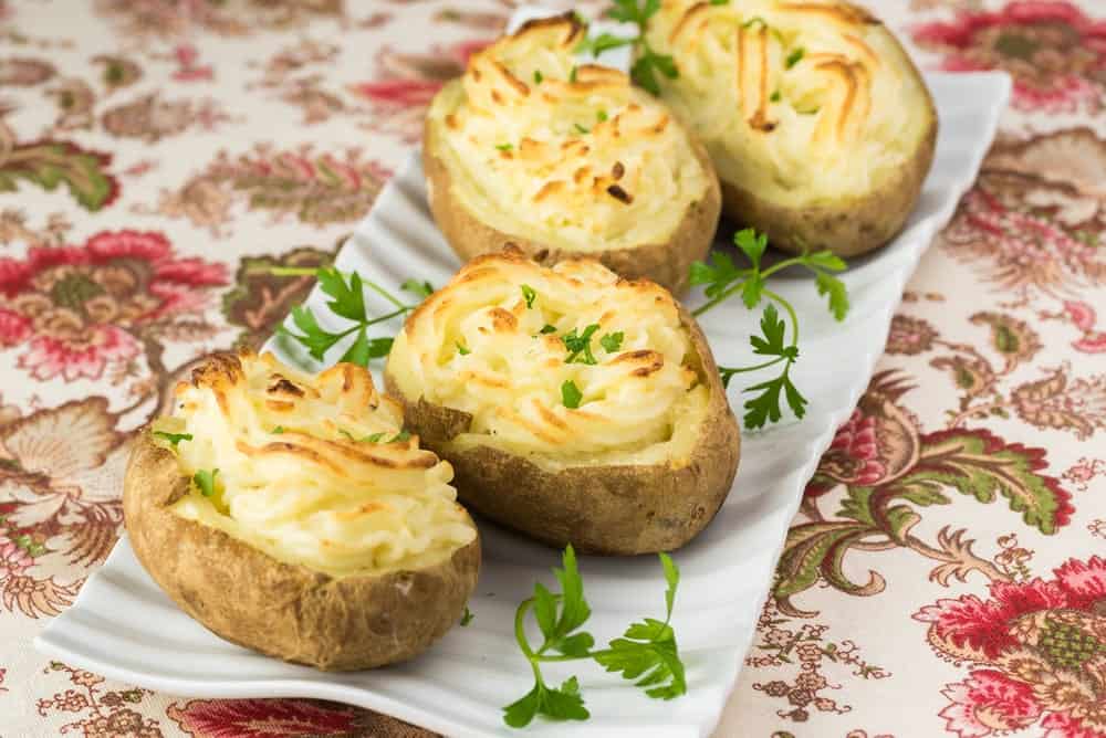 A plate of fresh twice-baked potatoes.
