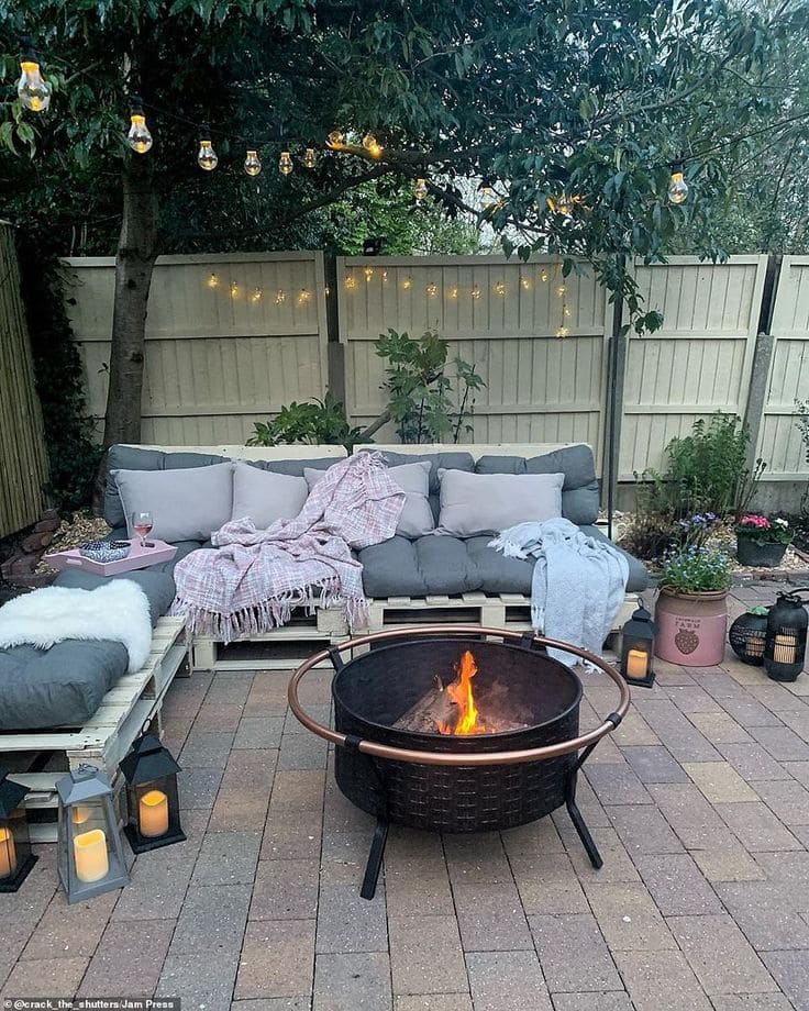 Charming Backyard Firepit and Sofa Retreat